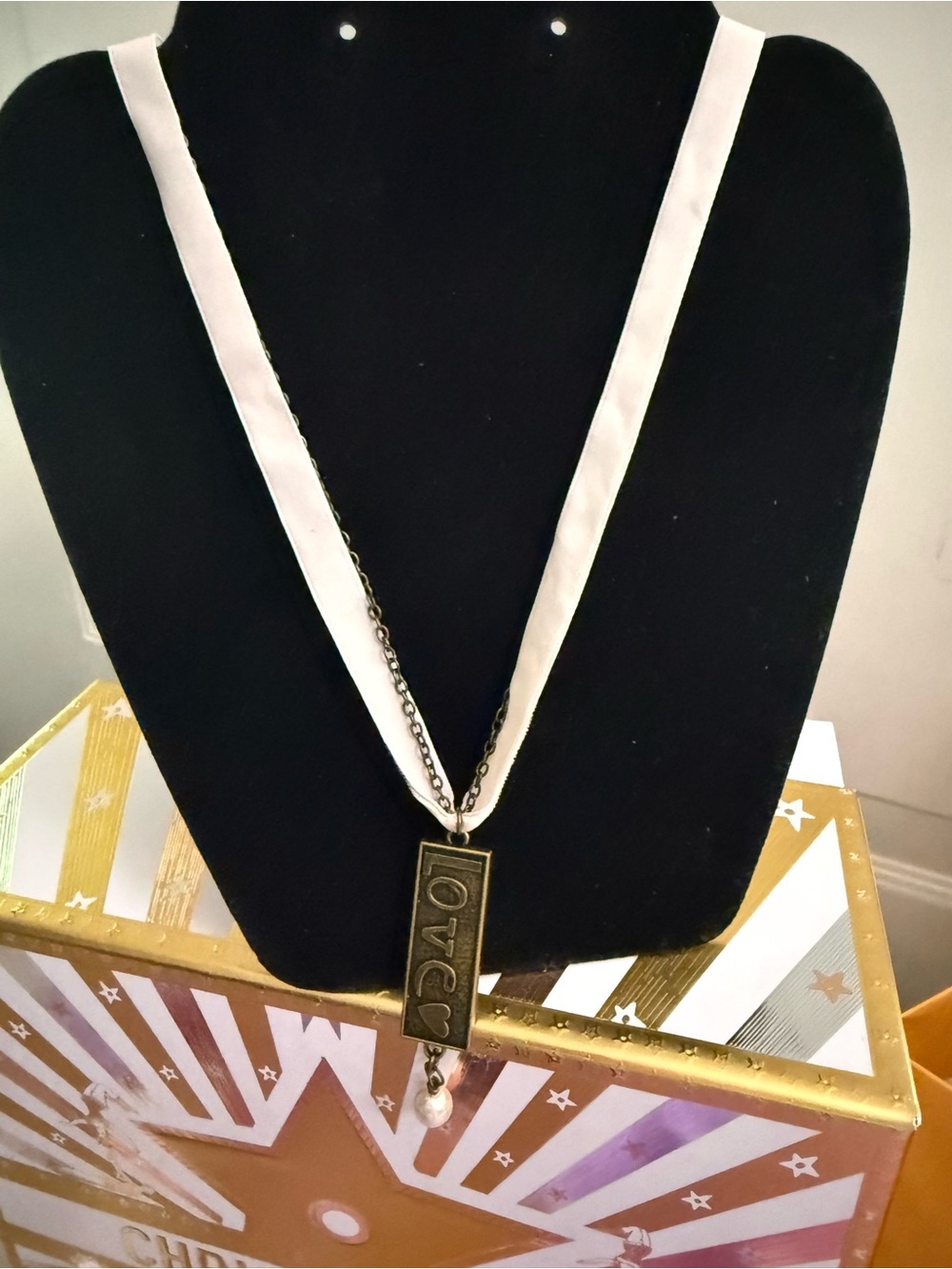 DEMDACO White ribbon and chain ‘love’ Embossed Charm Necklace.